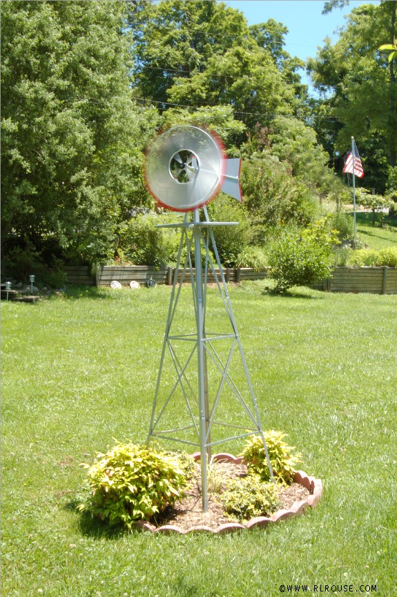 Dad's windmill spinning with the wind.