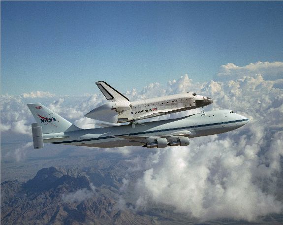 The Space Shuttle Discovery riding atop a Boeing 747.