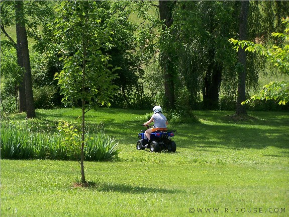 Olivia riding her new ATV.