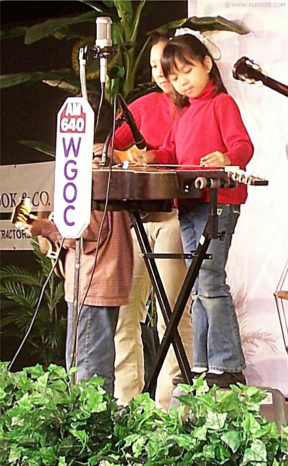 Alyssa Skinner playing her Dobro on the Pickin' Porch stage.