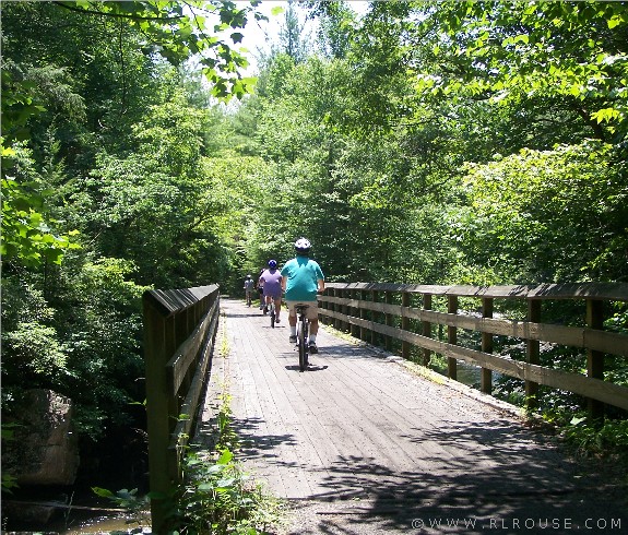 Bicyclists crossing a bridge on the Virginia Creeper Trail.