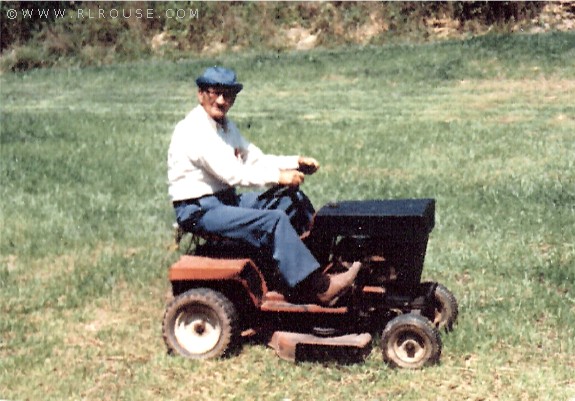 Dad on a lawnmower.
