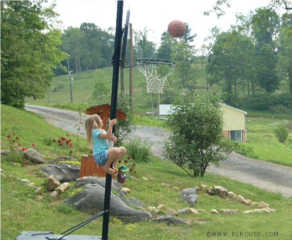My niece Hannah climbing a pole.