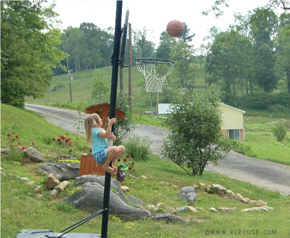 My niece Hannah climbing a pole.