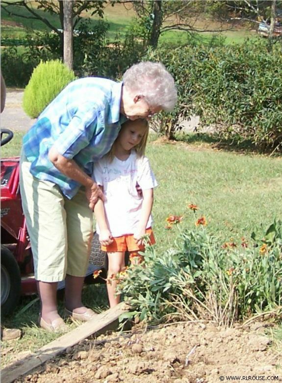 Mom & Hannah working on a flower bed.