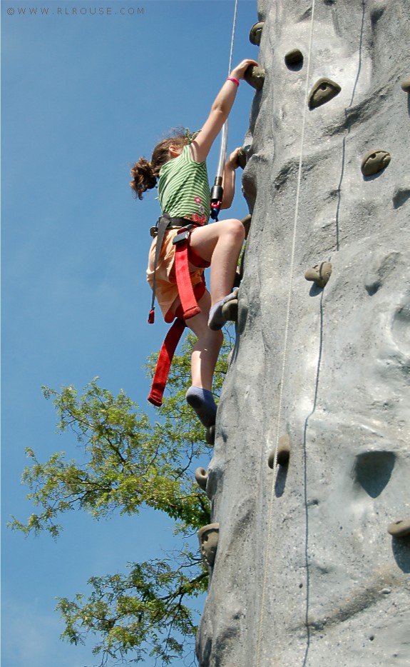 My little cousin Jordan climbing a rock wall.